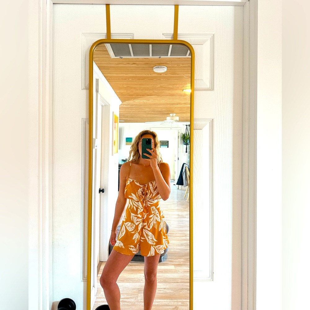 Blue Blush yellow and white romper. Size medium.